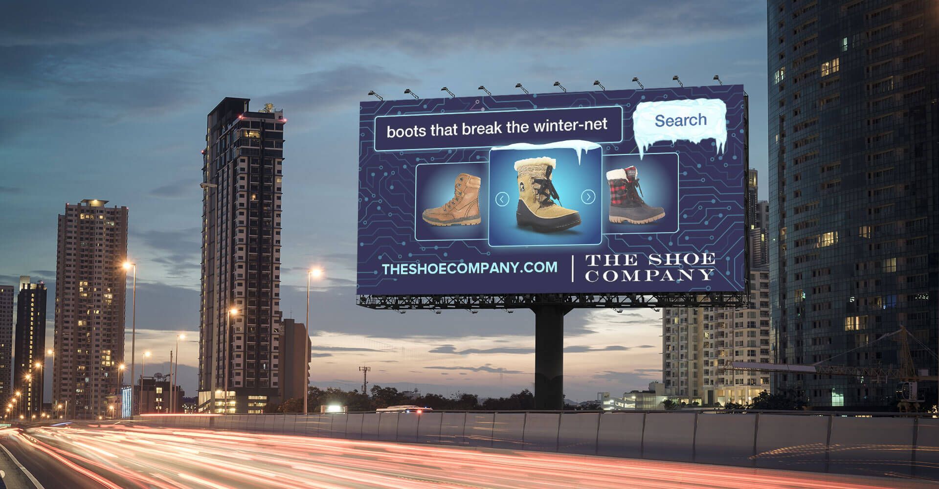 A billboard on the side of a highway advertises the shoes company
