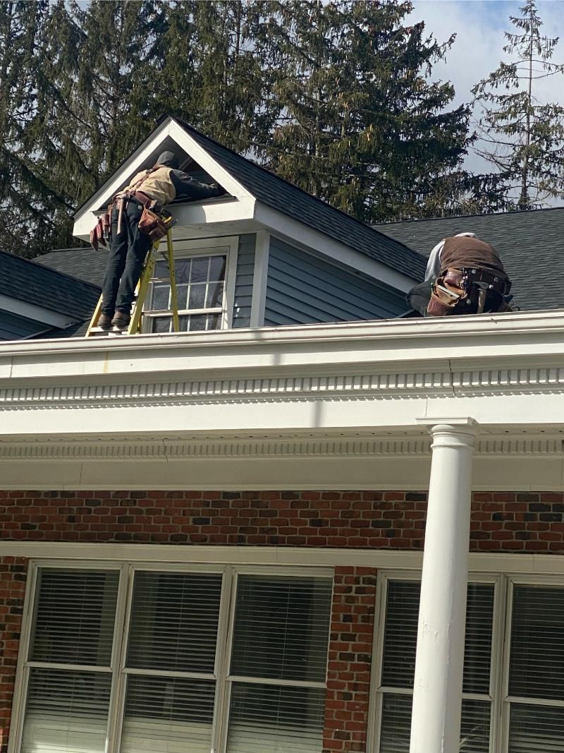 Expert technician performing a roof repair NJ to fix a leak in Union County.