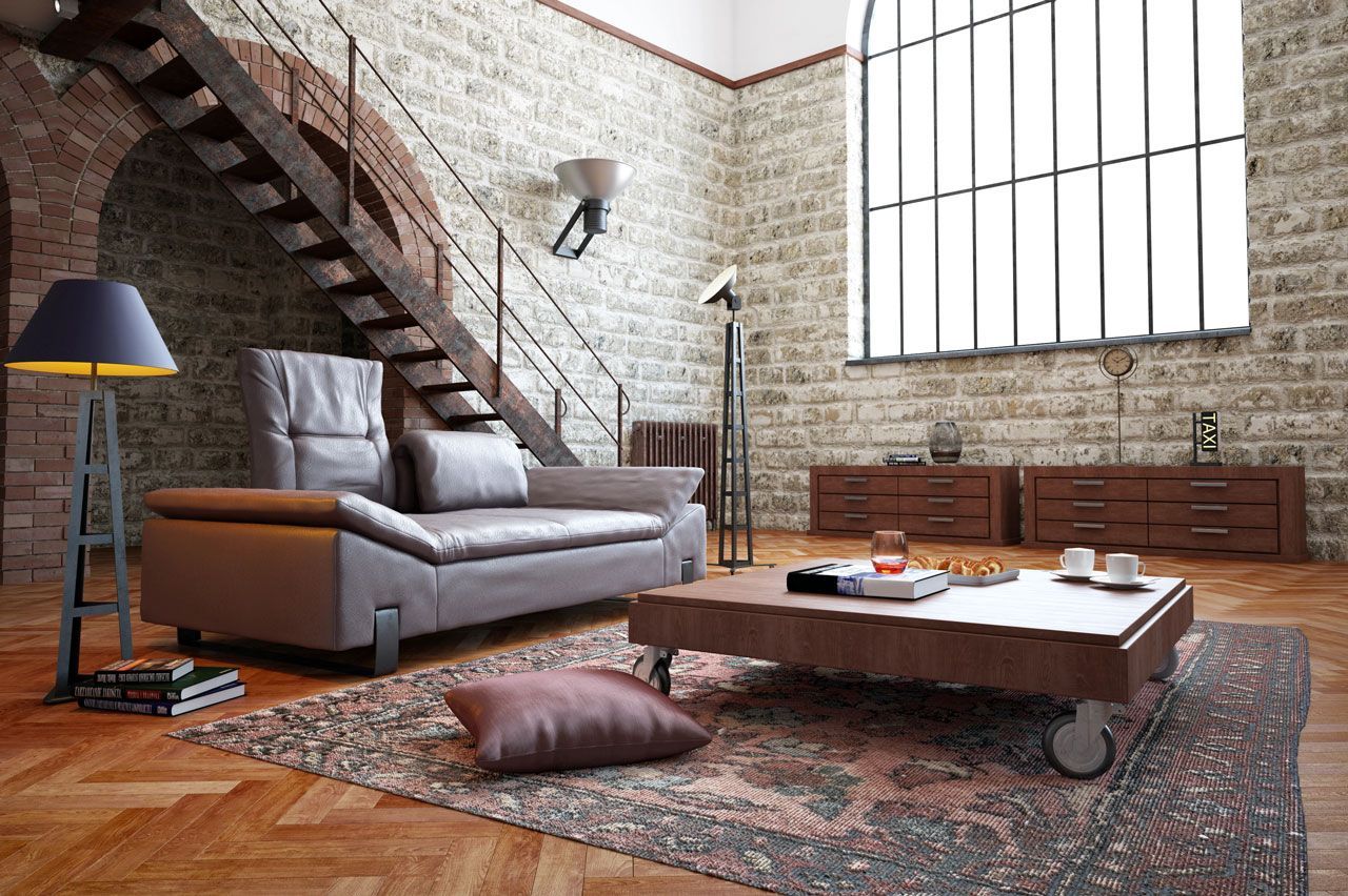 Cozy living room with fireplace, light blue sofa, wooden floor, and a small round table with plants.