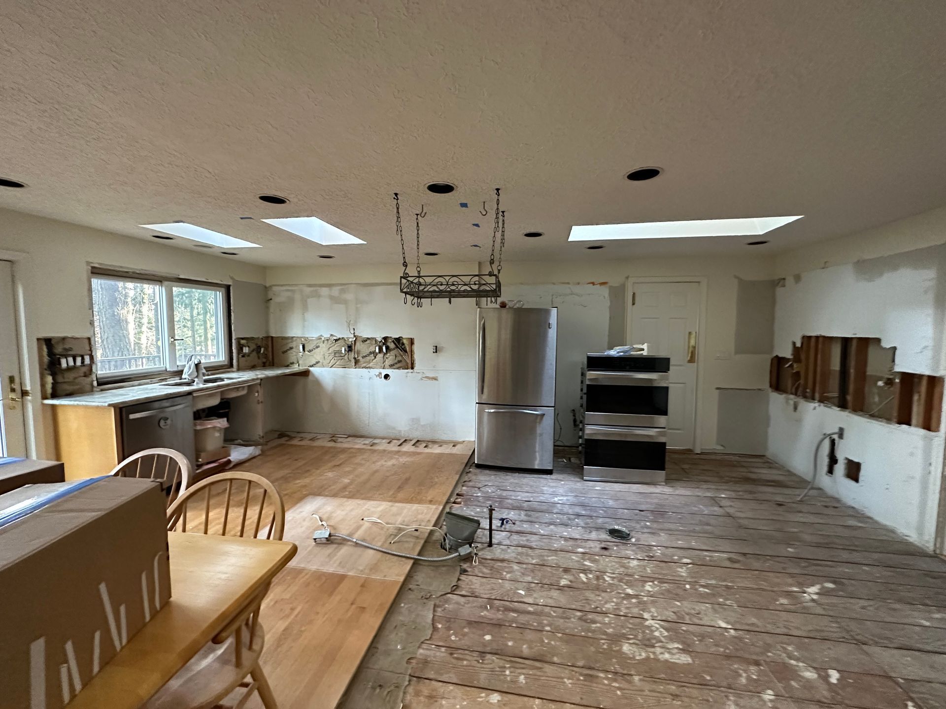 A kitchen with a refrigerator , stove , and dishwasher.