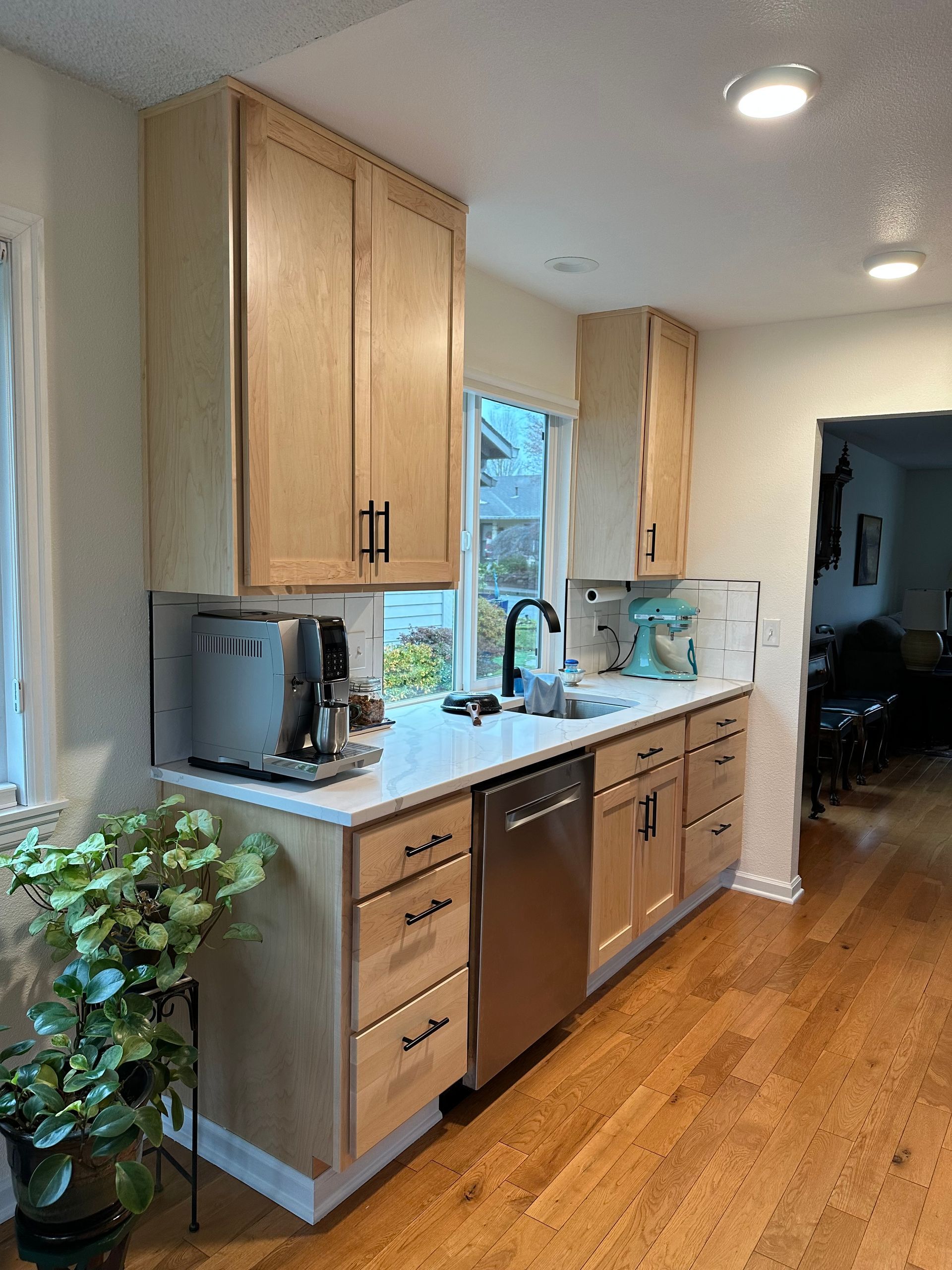 A kitchen with wooden cabinets and stainless steel appliances
