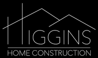 A logo for higgins home construction with a mountain in the background.