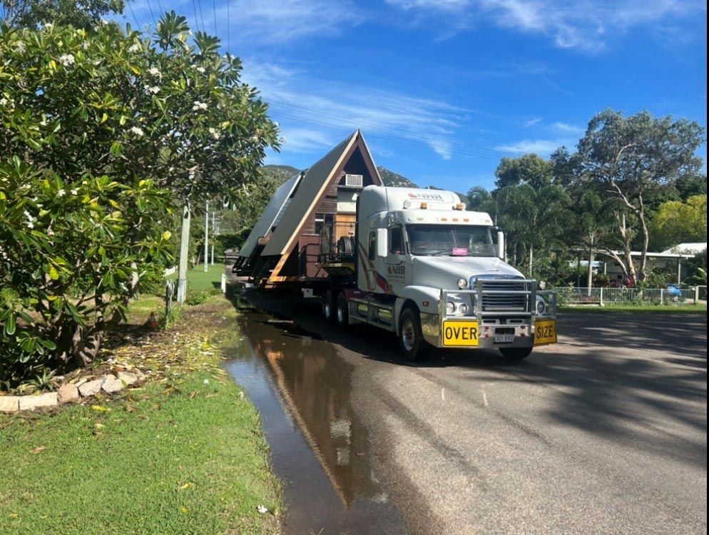 Modern Home Being Transported — House Lifting Services in Garbutt, QLD
