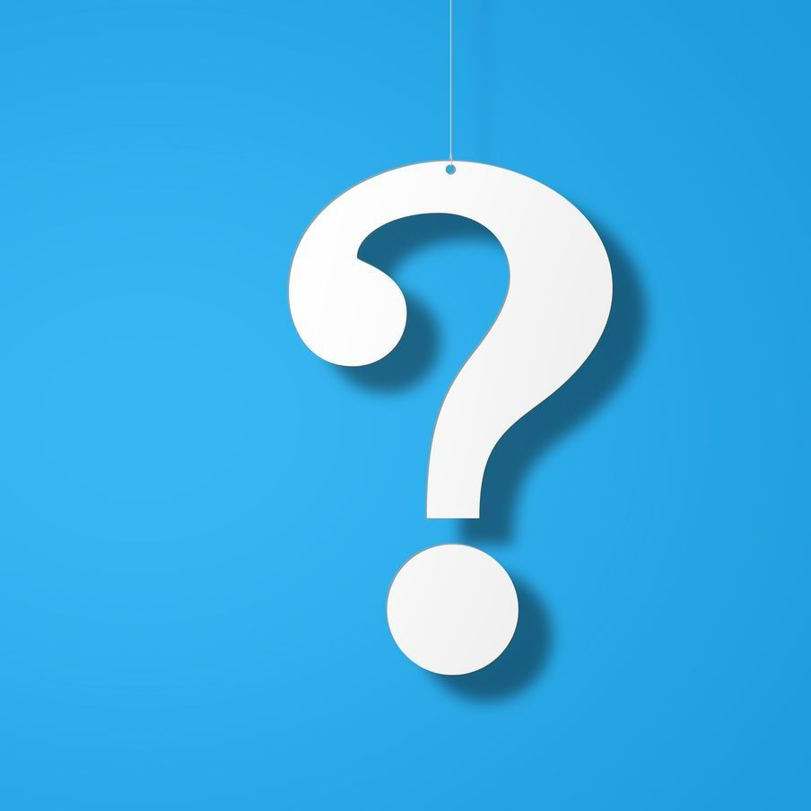 Question mark hanging from a string on a blue background