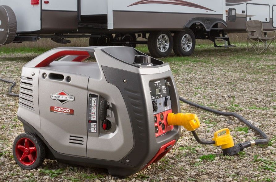 A Generator is Sitting on the Ground Next to a Trailer — Jacksons Mower Centre in Mackay, QLD