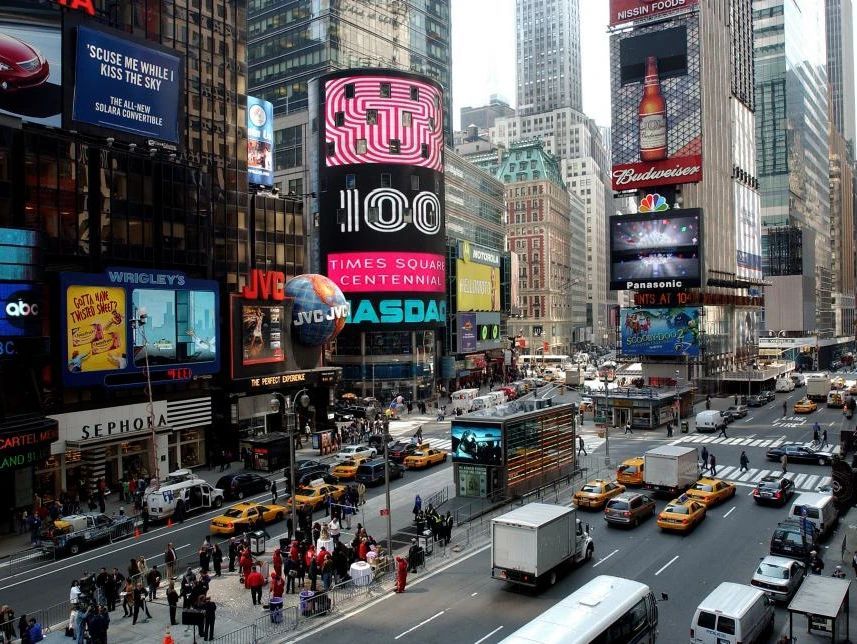 A busy city street with a sign that says asda on it