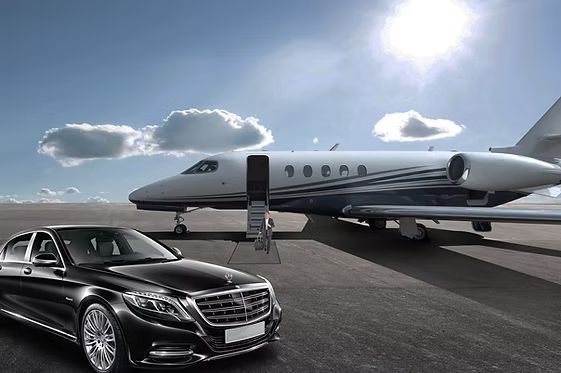 A car is parked next to a private jet on a runway.