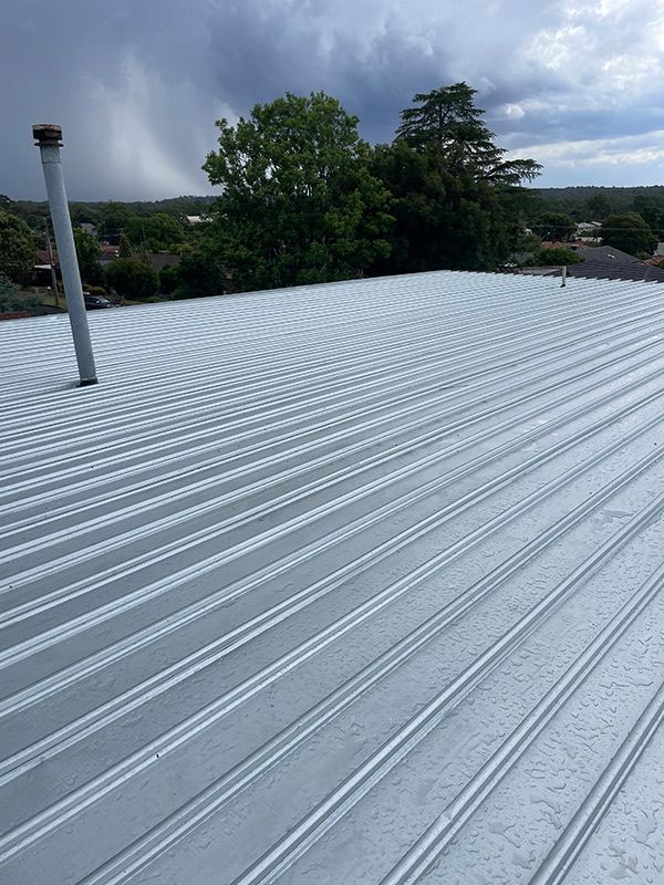 A Metal Roof with A Chimney on Top of It — BJB Plumbing & Gasfitting in Bourke, NSW