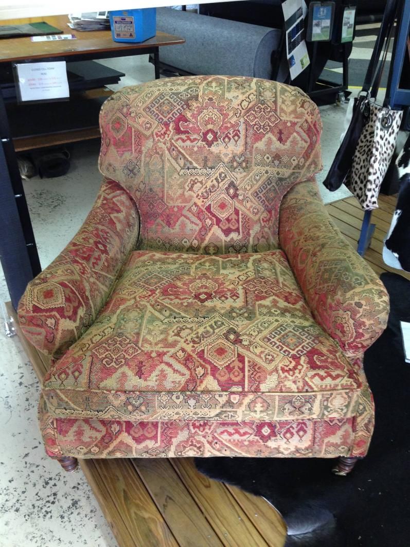 A Chair With a Pattern on It is Sitting on a Wooden Floor — Dennys Upholstery & Outdoor Blinds In Lismore, NSW