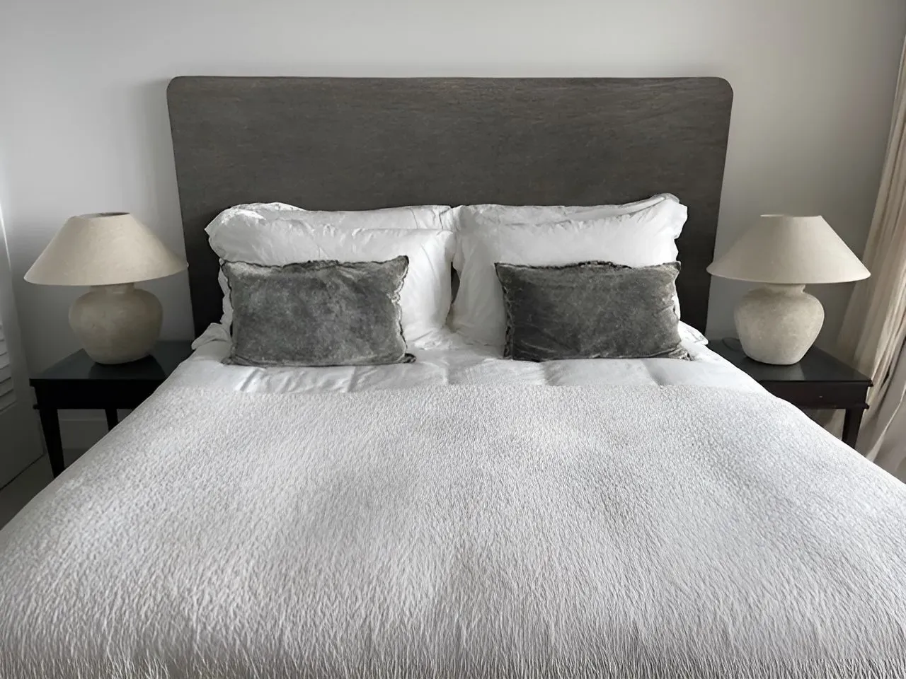 A Bedroom With a Bed and Two Lamps — Dennys Upholstery & Outdoor Blinds In South Lismore, NSW