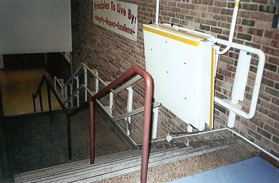 Stairs with a sign that says people to live by