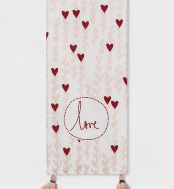 A scarf with hearts and the word love on it