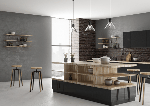 A kitchen with a large island in the middle and stools.