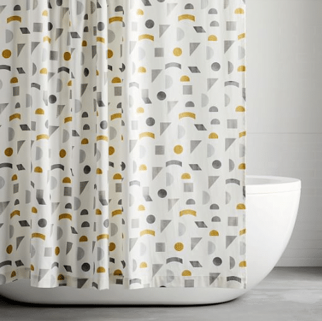 A shower curtain is hanging over a bathtub in a bathroom