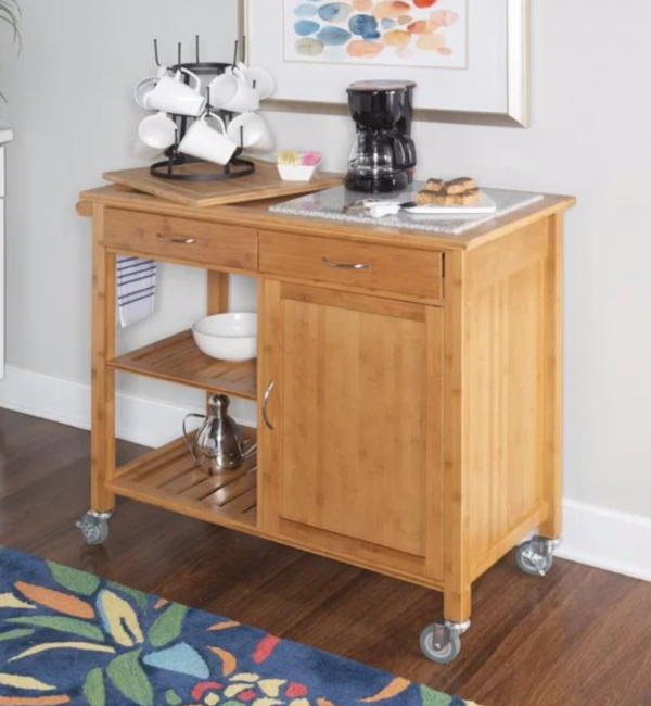 A wooden cart with a coffee maker on top of it