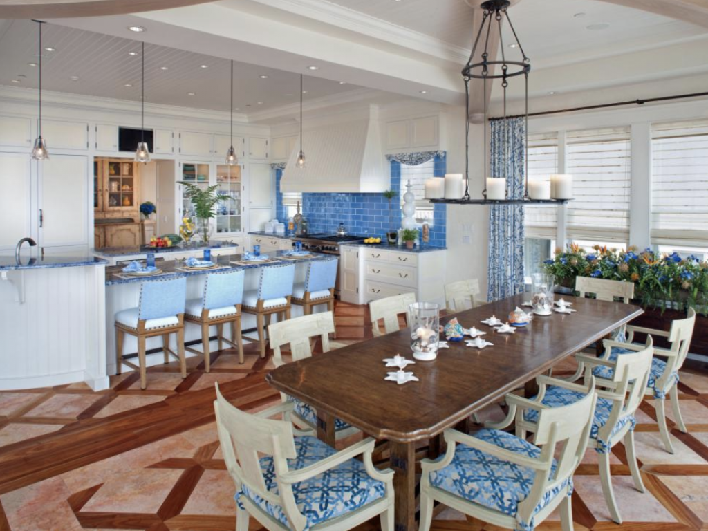 A dining room with a long table and chairs
