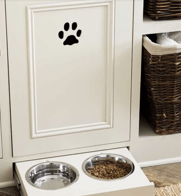 A dog food dispenser with a paw print on the door