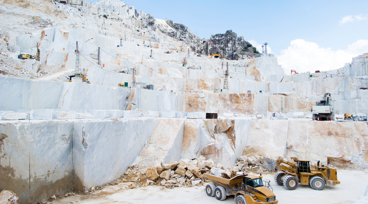 A marble quarry with a lot of machinery in it.