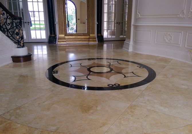 A marble floor with a circular design in the middle