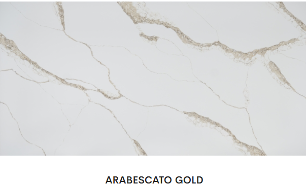 A close up of a white and gold marble counter top.