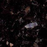 A close up of a black granite counter top.