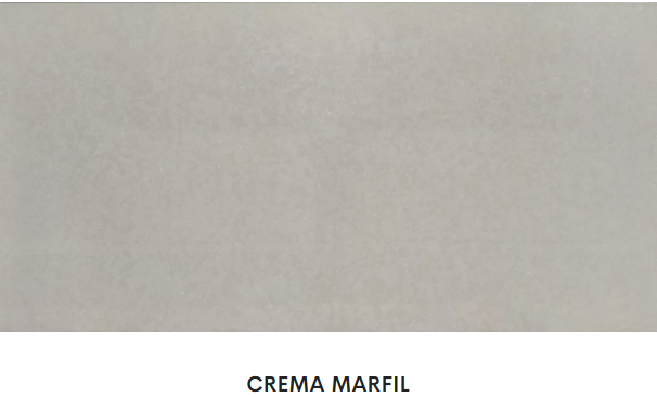 A close up of a white tile with the word crema marfil on it.