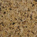 A close up of a yellow granite counter top.