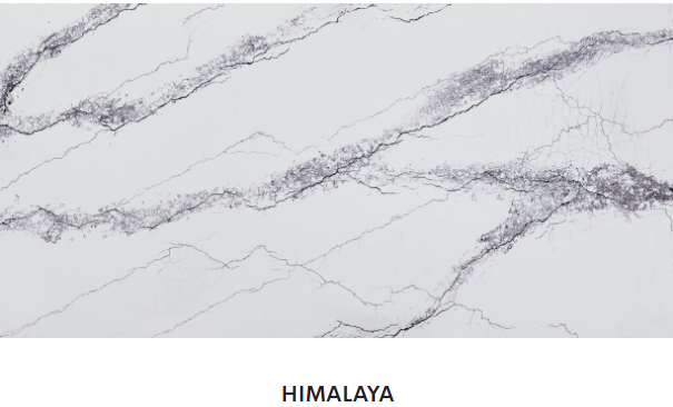 A close up of a white marble counter top with gray veins.