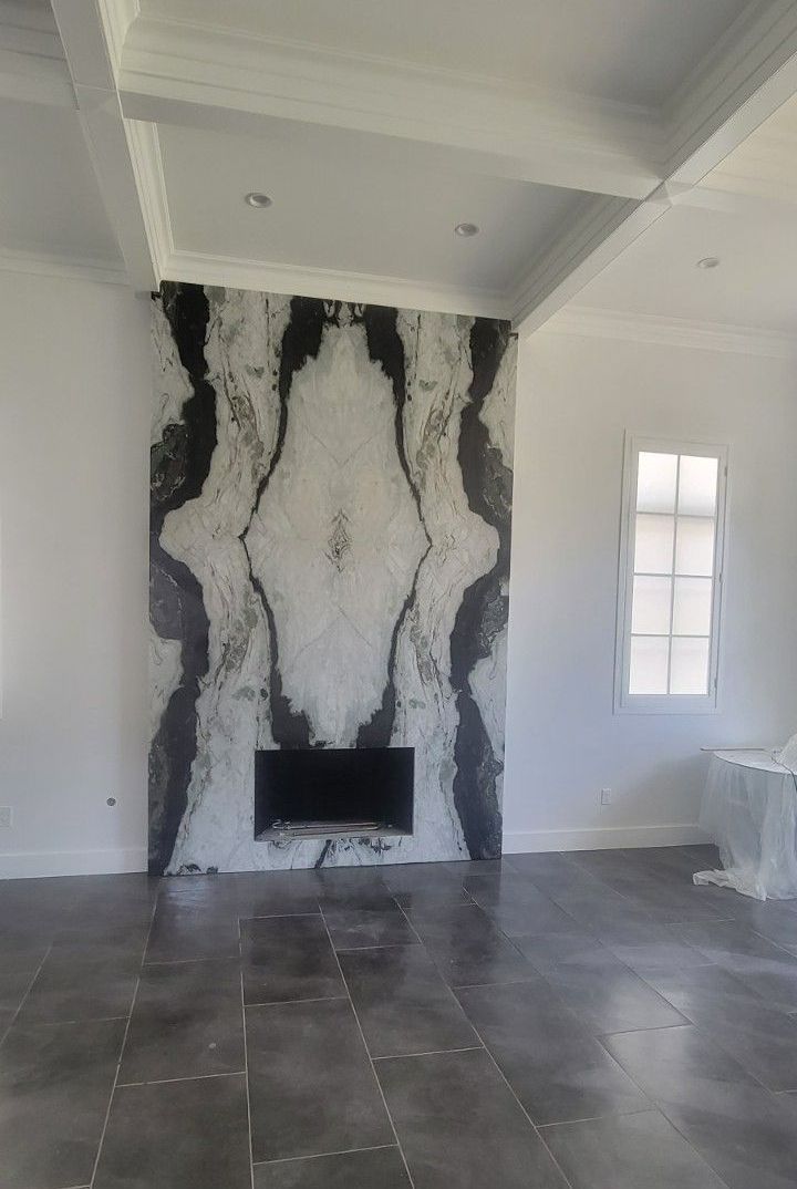 There is a fireplace in the middle of the room.