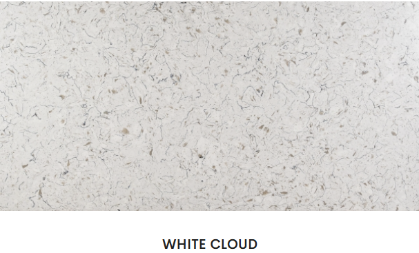 A close up of a white cloud granite counter top.