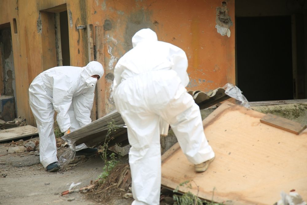 Worker with White Protective Suit — Asbestos Removal in Gold Coast, QLD