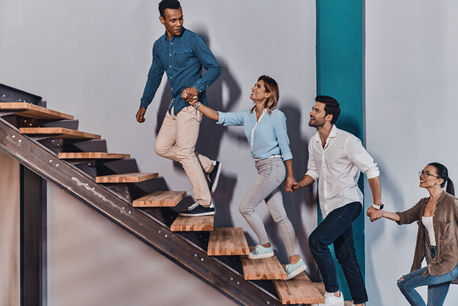 A group of people are walking up a set of stairs.