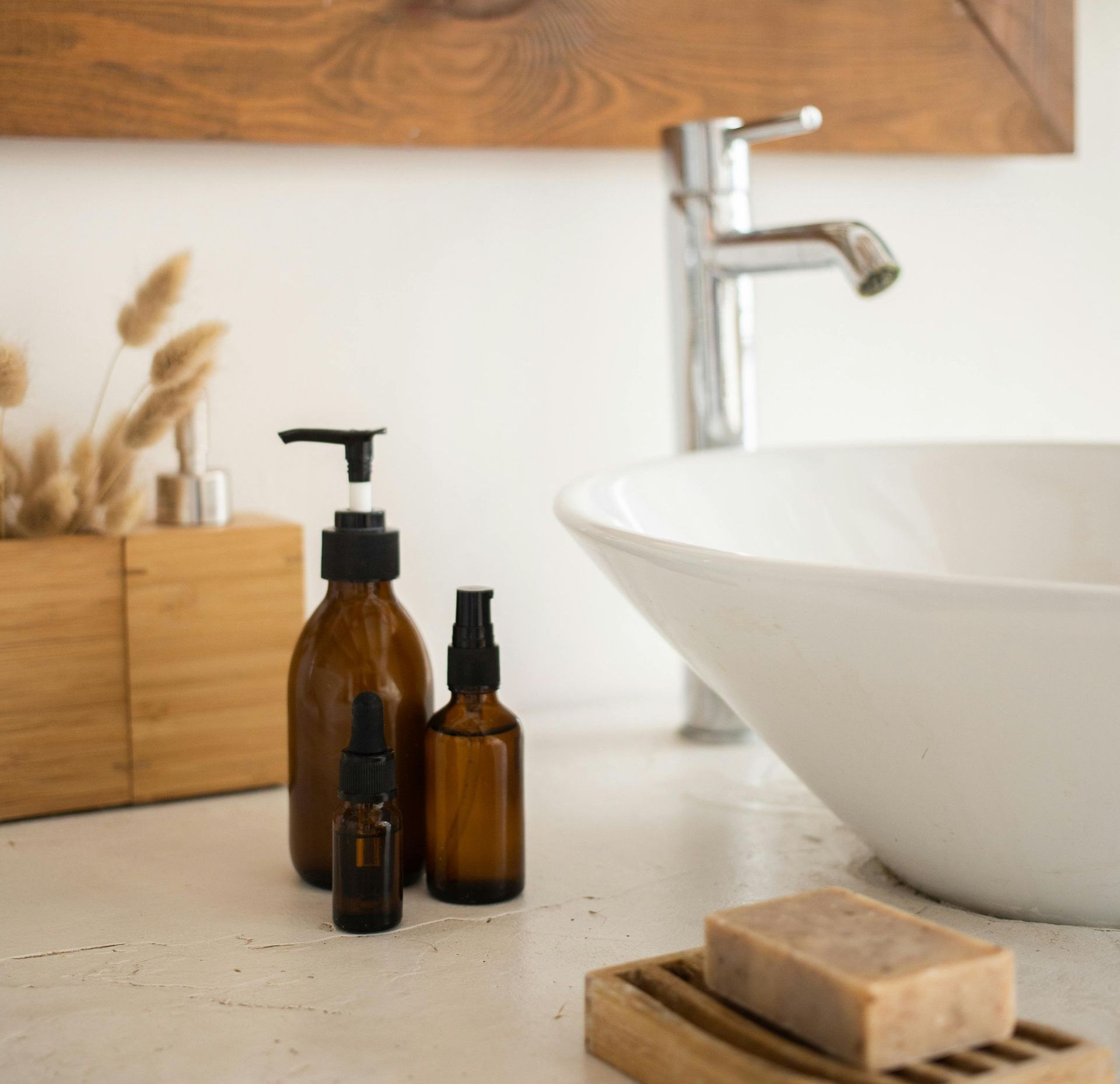 A bathroom with a sink and soap on the counter