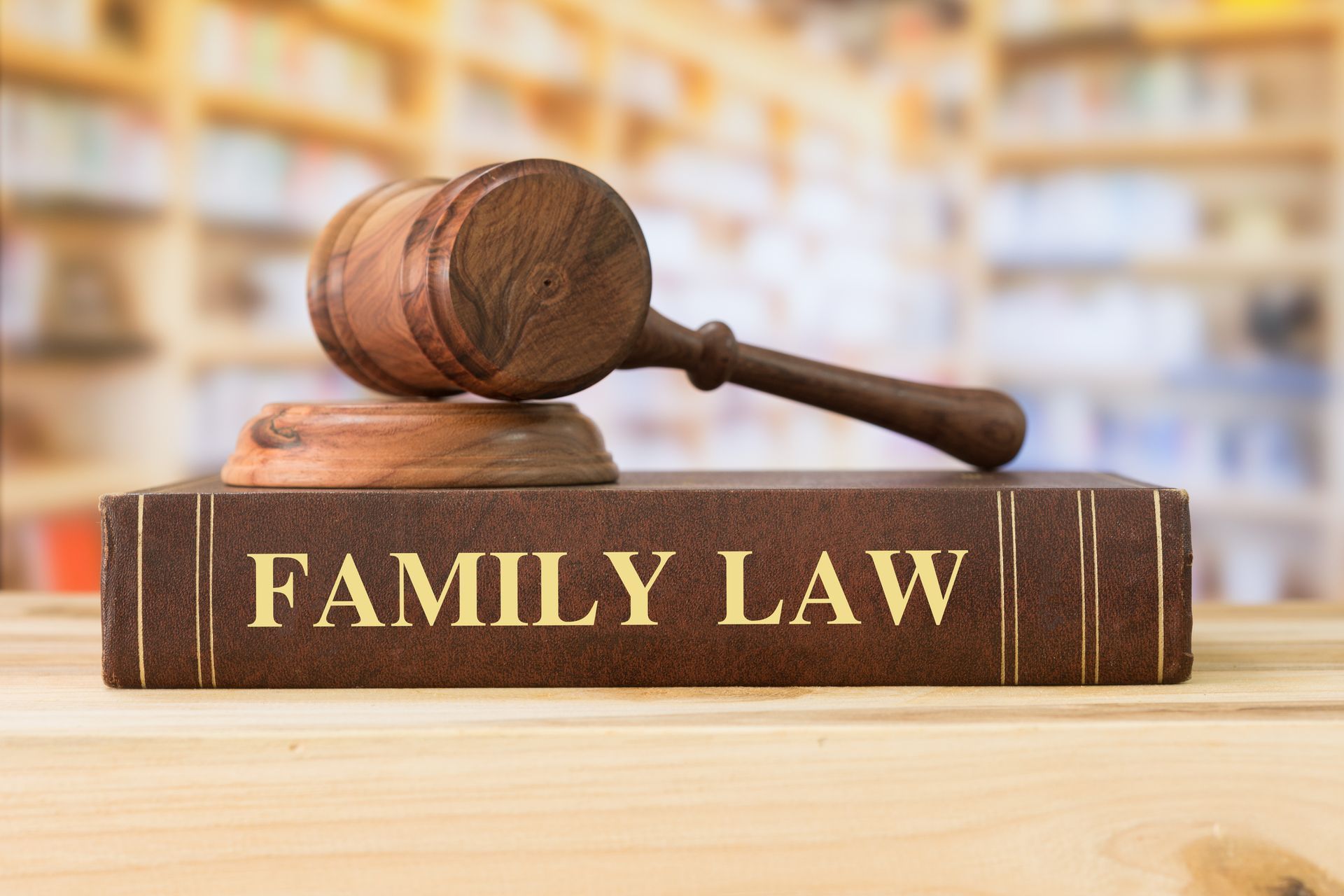 Family Law books with a judges gavel on desk in the library |Rosen Lawyers| Brisbane | 