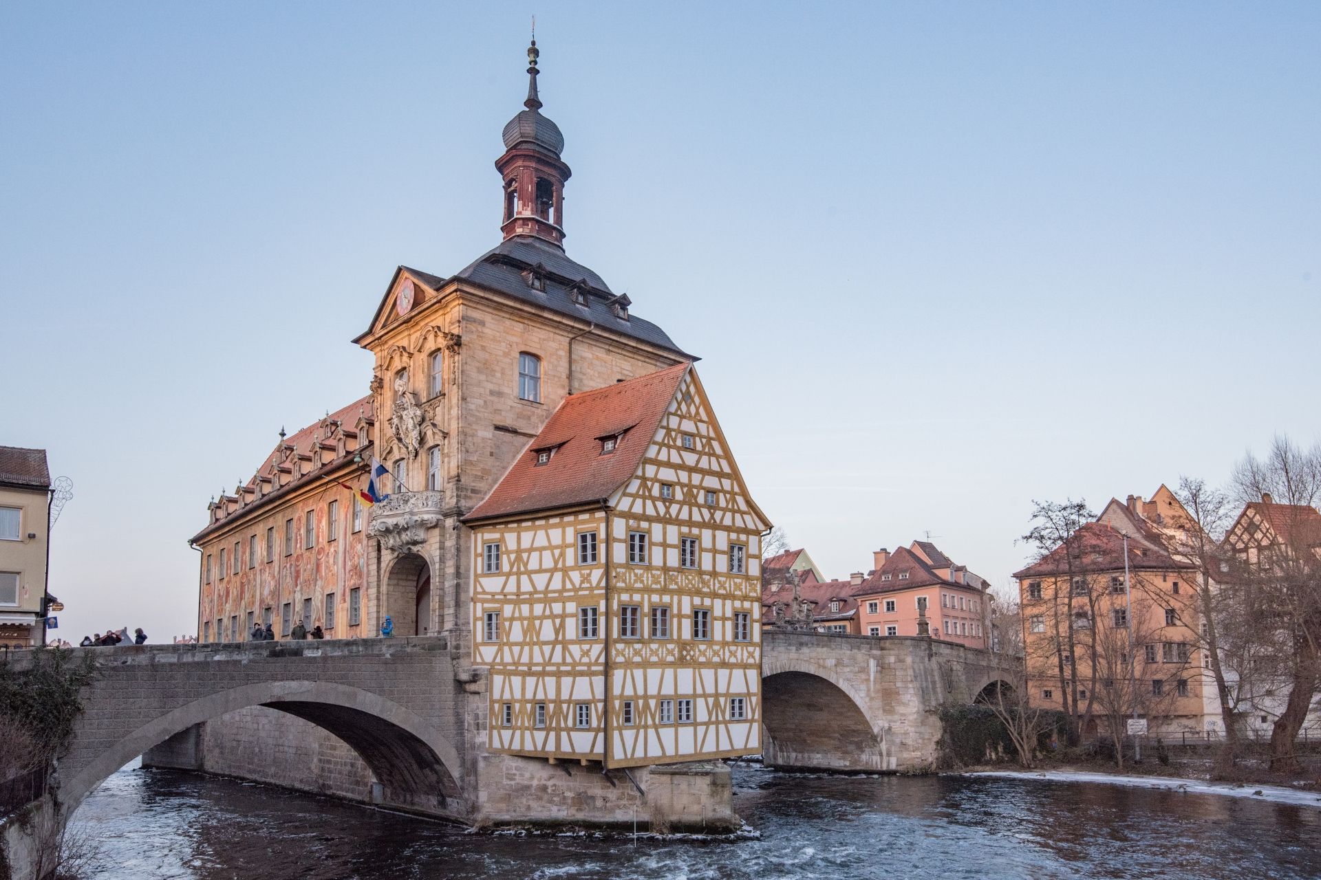 Bamberg Old Town Hall, built on an island in a river, with bridge access; tan and red buildings.