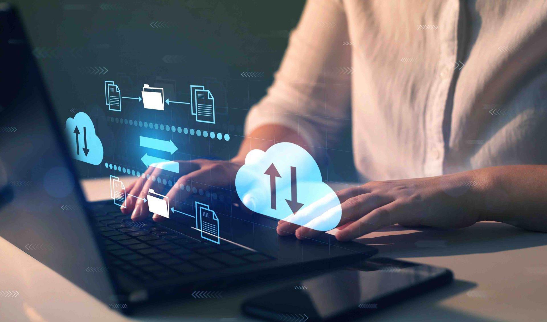 Hands typing on a laptop with glowing cloud upload icons and digital network graphics.