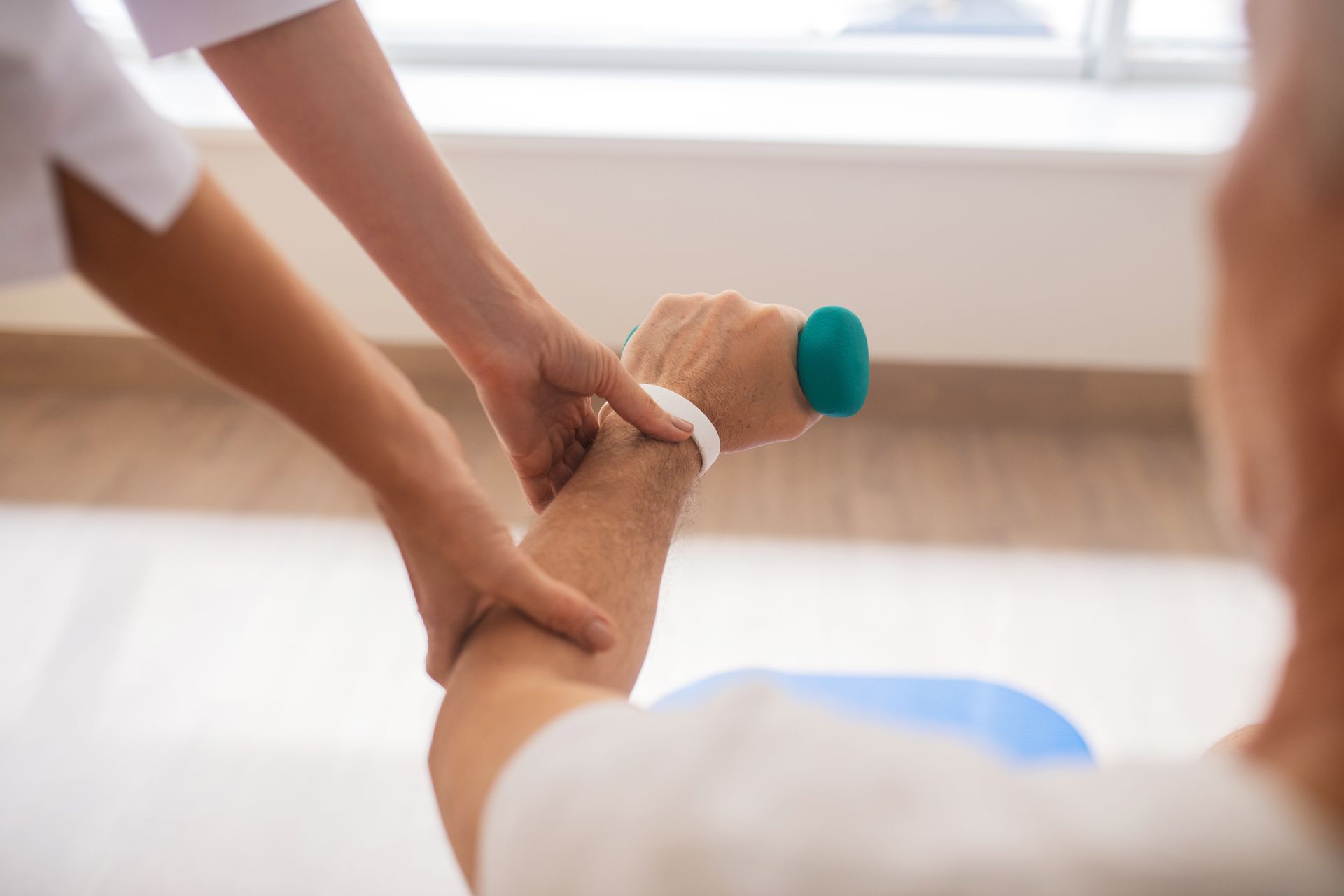 a person is holding a green ball on their wrist
