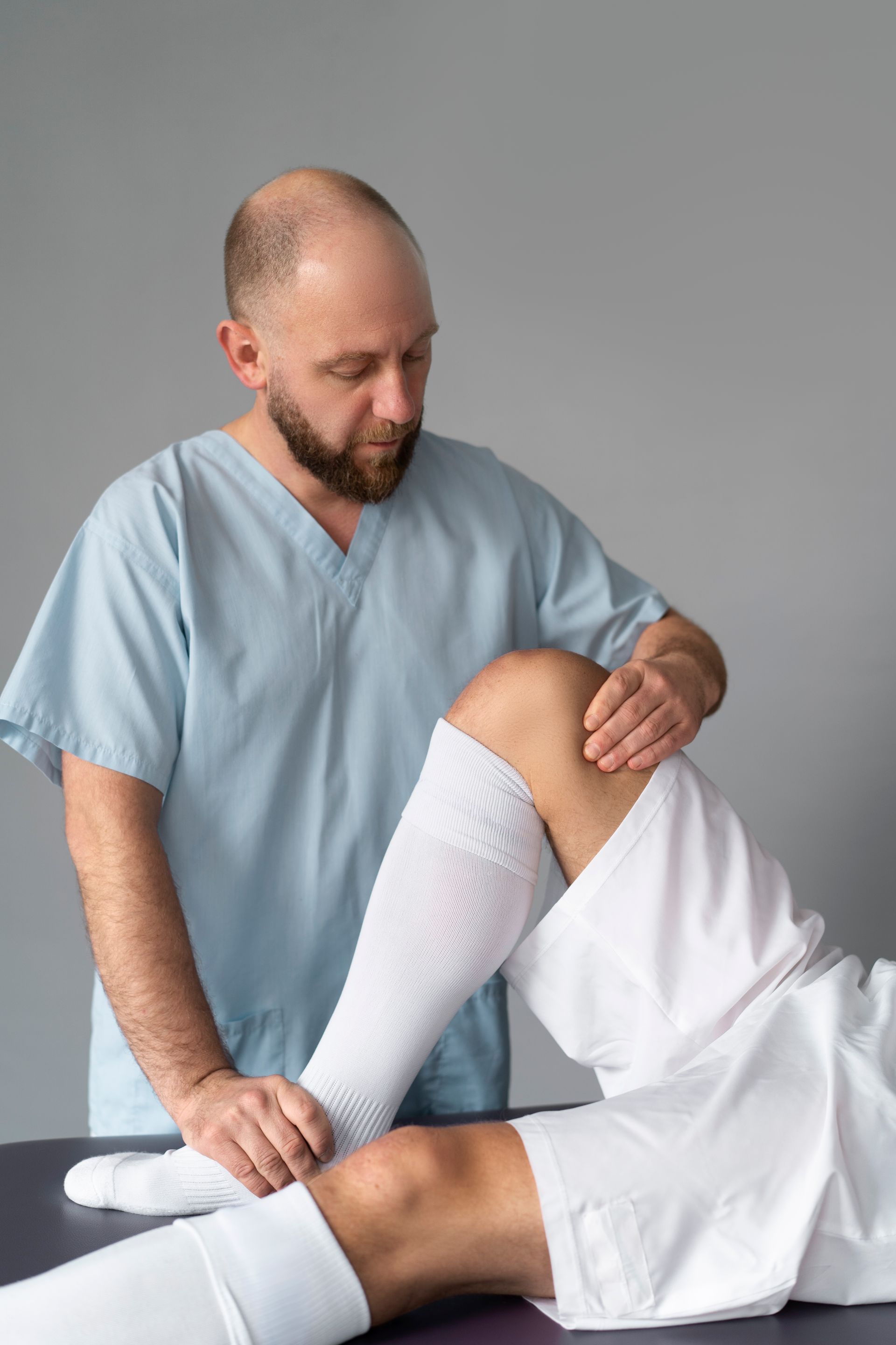 doctor helping athlete patient 