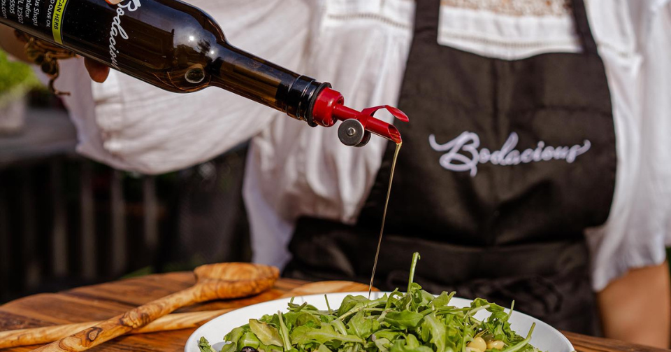 A woman  preparing salad in our open kitchen