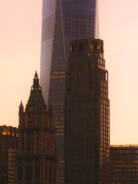 City skyline A city skyline with a tall building in the foreground