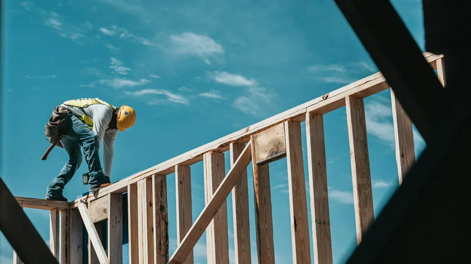 Construction worker framing a new home. 