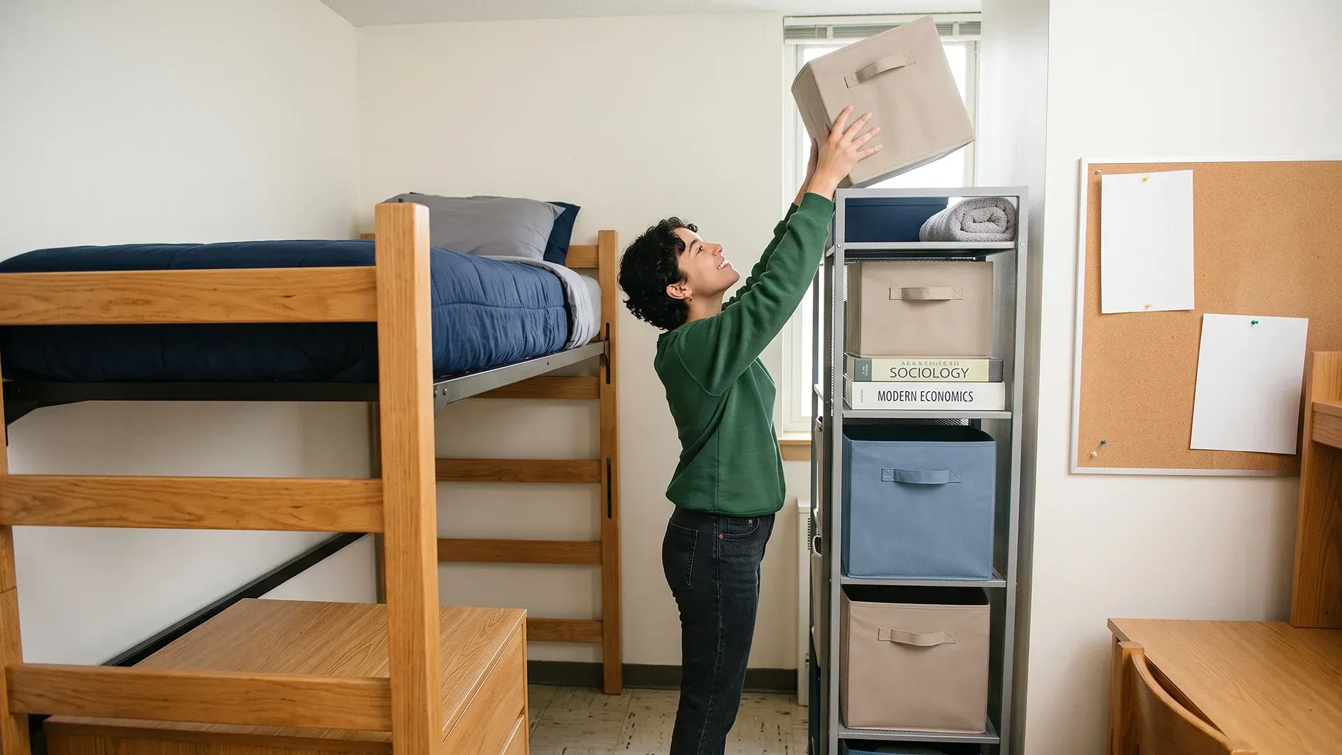 Student dorm room starting to fill with unopened boxes