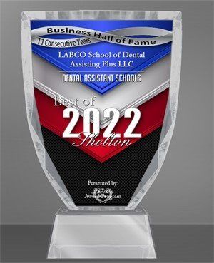 Dental School Award 2022 a plaque that says best of 2022 on it .