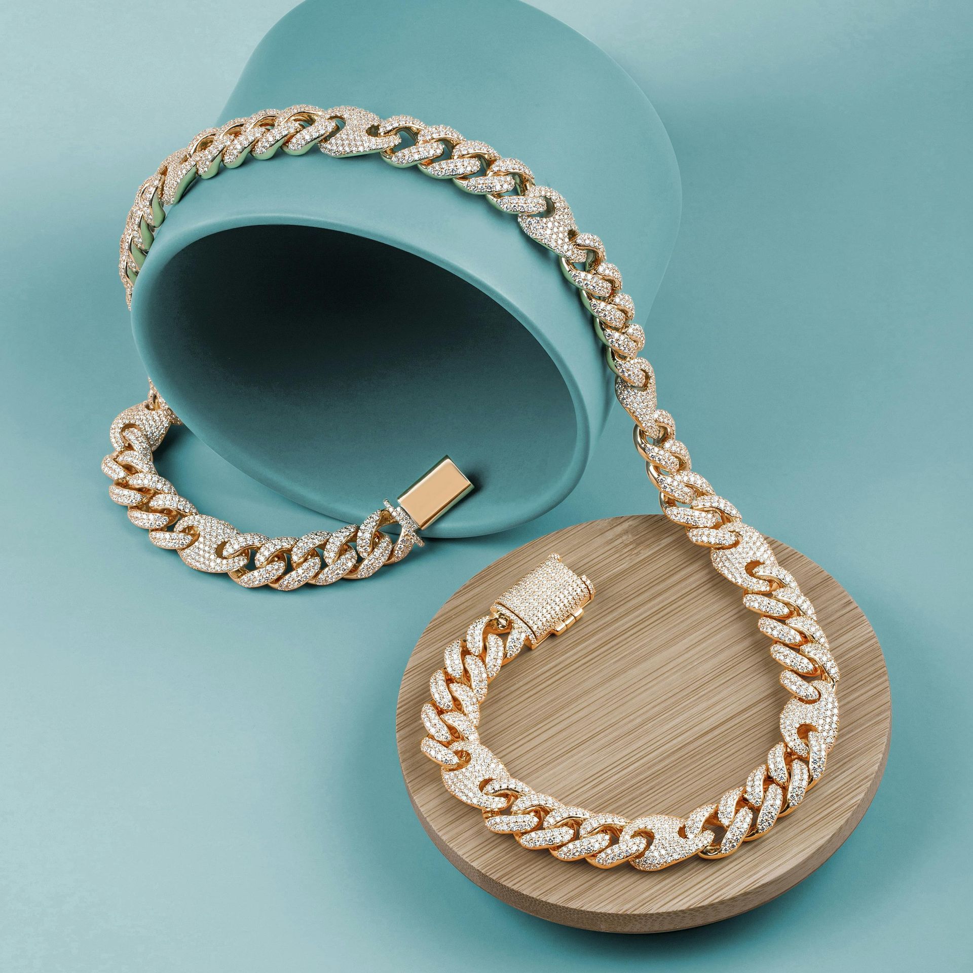 A necklace and bracelet are sitting on a wooden plate.