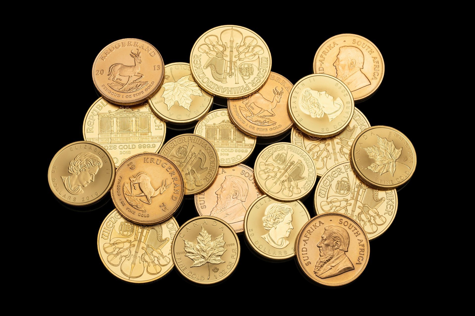 A pile of gold coins on a black background.