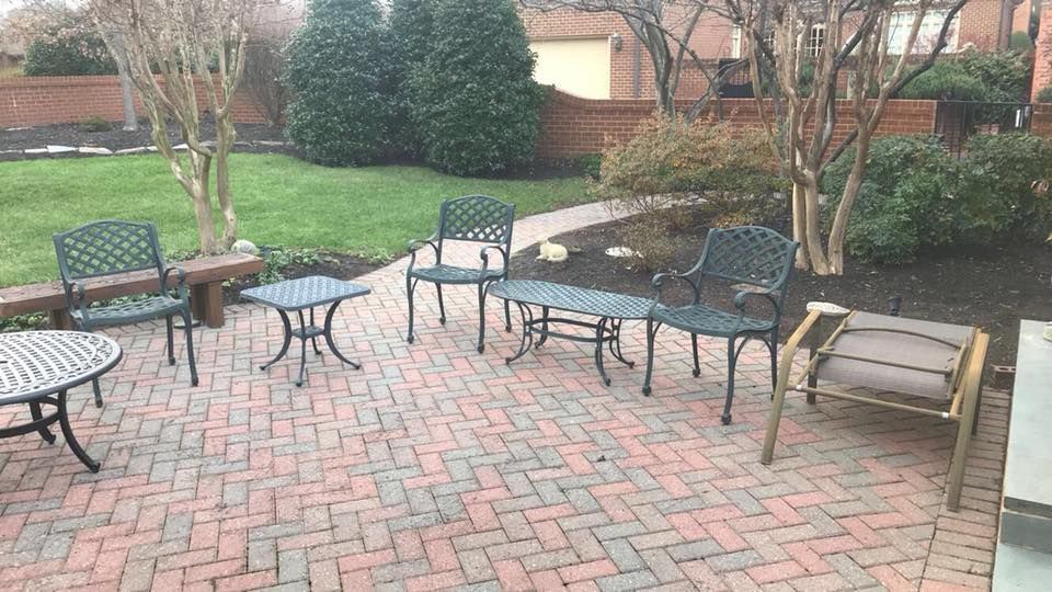 A patio with a table and chairs on it