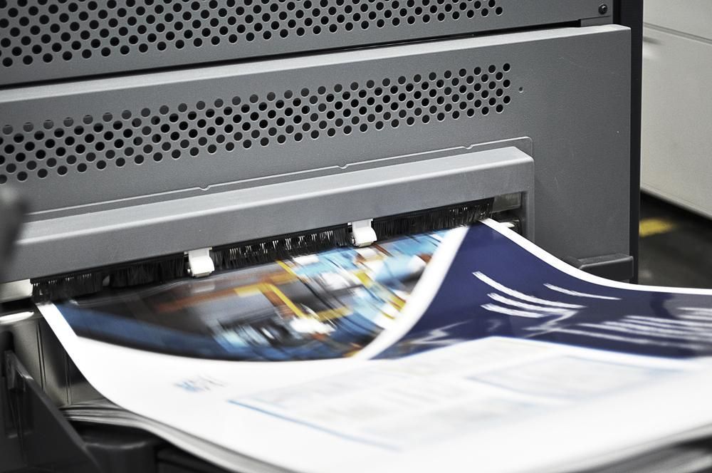 A Close up Of a Printer Printing a Piece of Paper — Signmax Bundaberg In Kensington, QLD