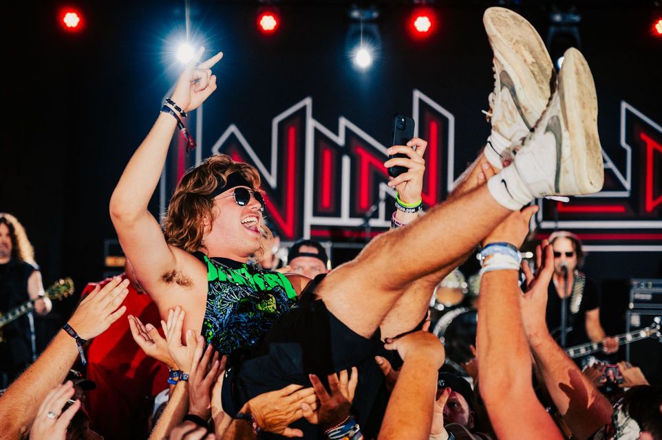 Crowd surfing concert goer