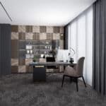 Modern office with desk, chair, shelves, and patterned wall paneling beside floor-to-ceiling windows