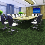 Modern conference room with long table, black office chairs, and a wall-mounted display on the far wall